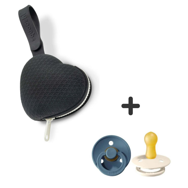 Black heart-shaped pacifier holder with zipper and silicone strap, paired with two BIBS pacifiers in petrol and ivory.