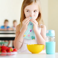 Girl with Squooshi reusable food pouch